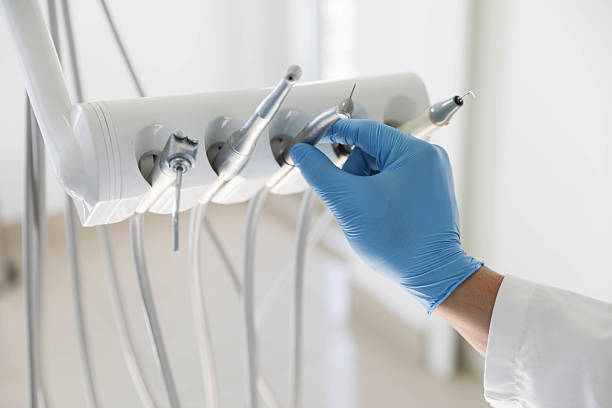Professional Tooth Extraction technician working in Carrollton, TX